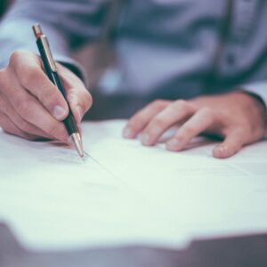 Lawyer writing legal documents and contracts