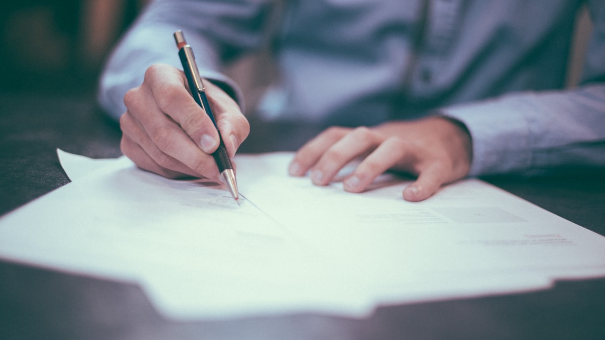 Lawyer writing legal documents and contracts